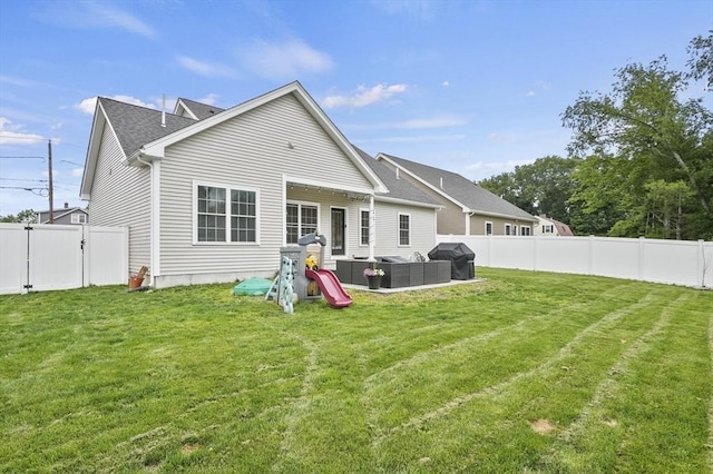 80 Edgemere Ave Unit 80, Northbridge, MA 01588 - back of property featuring a fenced backyard, an outdoor hangout area, a gate, a patio area, and a shingled roof