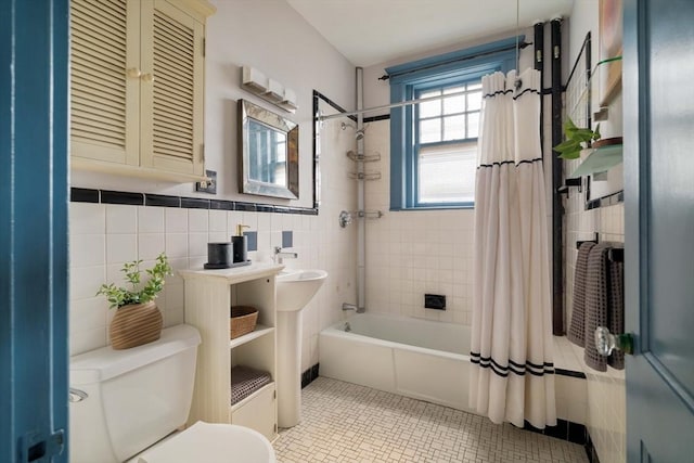 3 Newport Rd Unit 8, Cambridge, MA 02140 - bathroom featuring shower / bath combo, tile walls, and tile patterned flooring