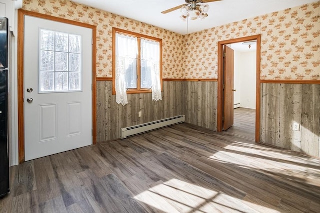 entryway featuring wood-type flooring, ceiling fan, and baseboard heating