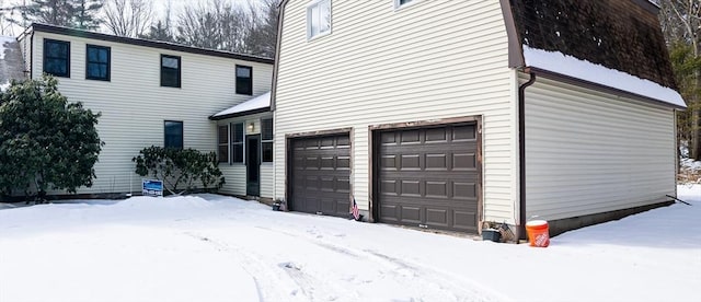 view of snow covered garage