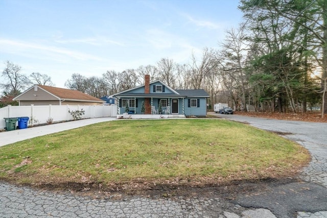 view of front of home with a front lawn and a porch