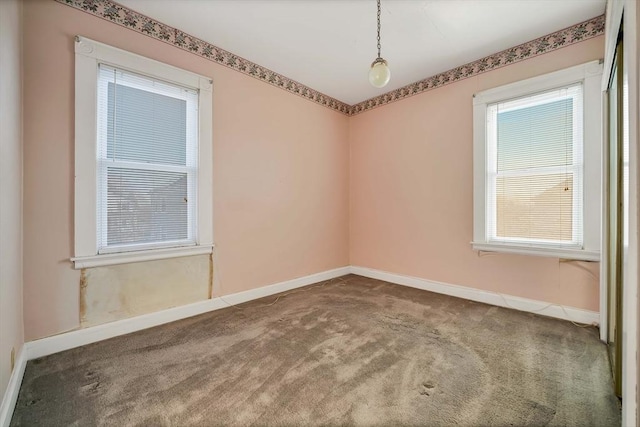 spare room with carpet flooring and baseboards