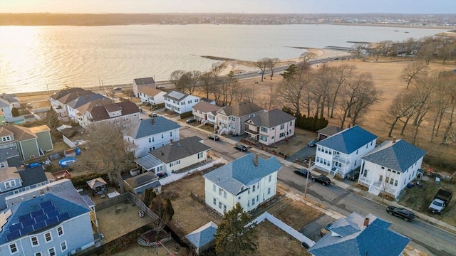 aerial view with a residential view and a water view