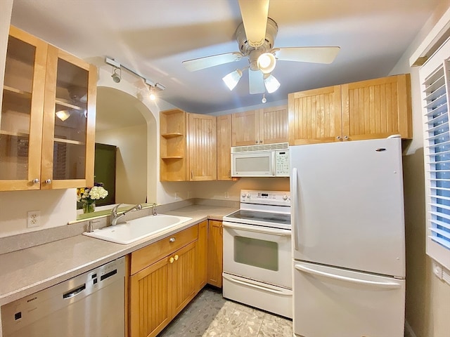 kitchen with light brown cabinets, sink, white appliances, and ceiling fan