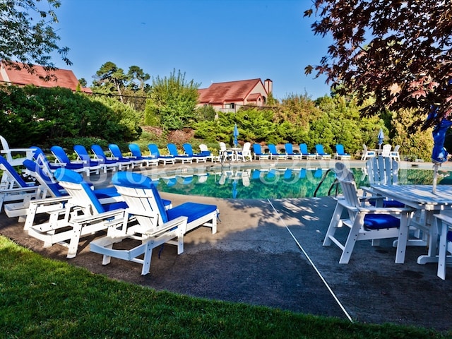 exterior space with a patio area and a pool