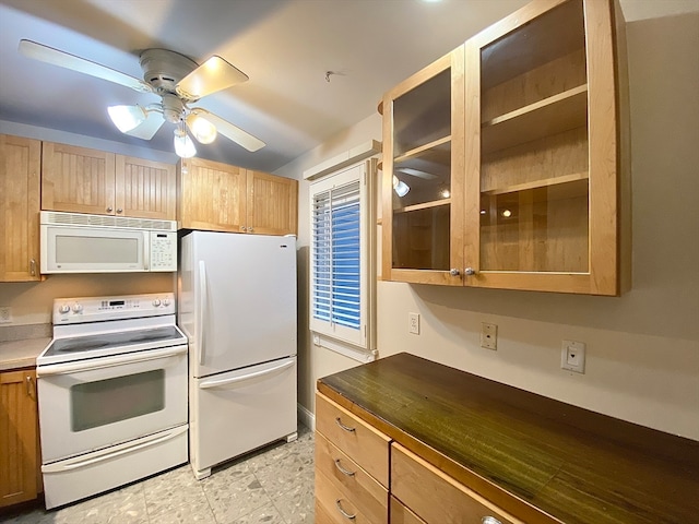 kitchen featuring white appliances and ceiling fan