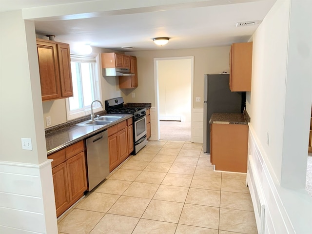 kitchen featuring sink, appliances with stainless steel finishes, and light tile patterned floors