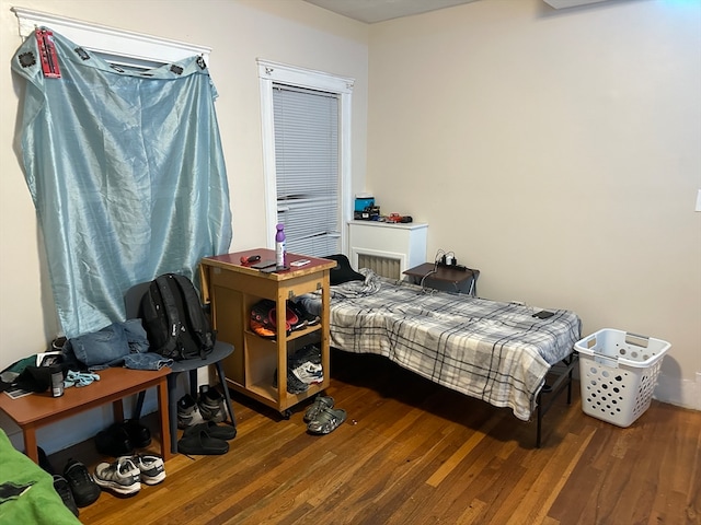 bedroom with hardwood / wood-style flooring