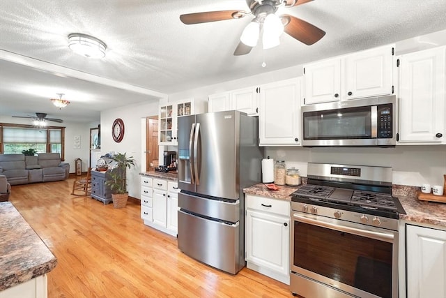 2 Pierce St, Agawam, MA 01030 - kitchen featuring stainless steel appliances, a ceiling fan, light wood-type flooring, white cabinetry, and a textured ceiling