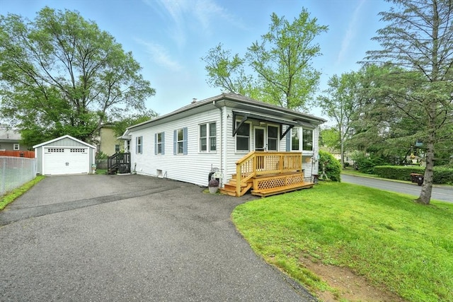 2 Pierce St, Agawam, MA 01030 - view of front facade with a detached garage, an outdoor structure, and driveway