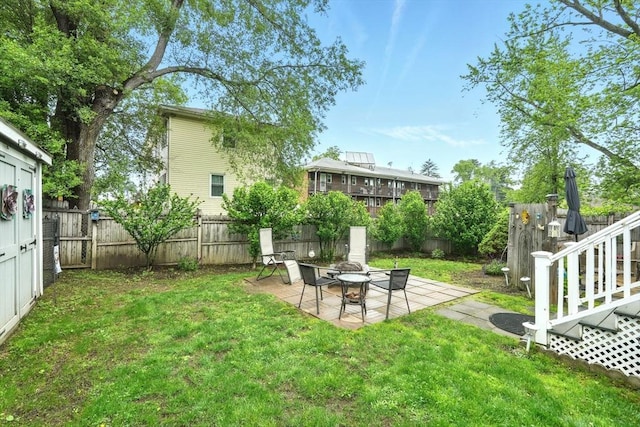 2 Pierce St, Agawam, MA 01030 - fenced backyard with a patio area and an outdoor fire pit