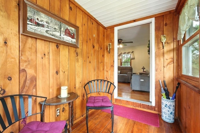 2 Pierce St, Agawam, MA 01030 - living area featuring wood-type flooring, wooden walls, and a ceiling fan