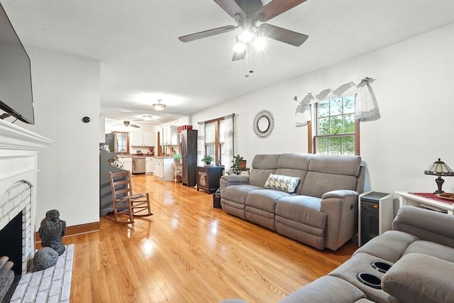 2 Pierce St, Agawam, MA 01030 - living room featuring ceiling fan, light wood finished floors, and a brick fireplace