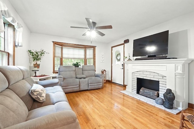 2 Pierce St, Agawam, MA 01030 - living area featuring a ceiling fan, light wood-style floors, and a brick fireplace