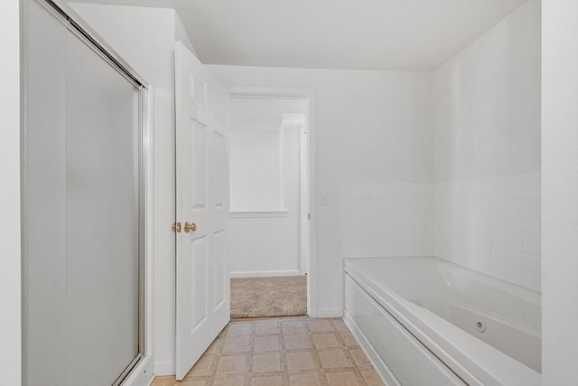 98 Caspian Way Unit 98, Fitchburg, MA 01420 - bathroom featuring tile patterned floors, a garden tub, baseboards, and an enclosed shower