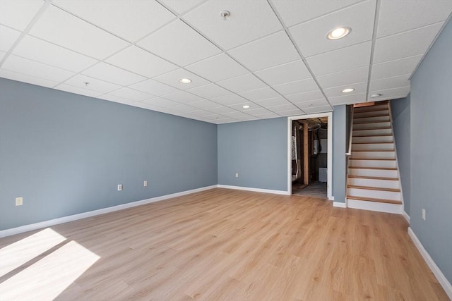 98 Caspian Way Unit 98, Fitchburg, MA 01420 - finished basement featuring light wood finished floors, a drop ceiling, baseboards, recessed lighting, and stairway