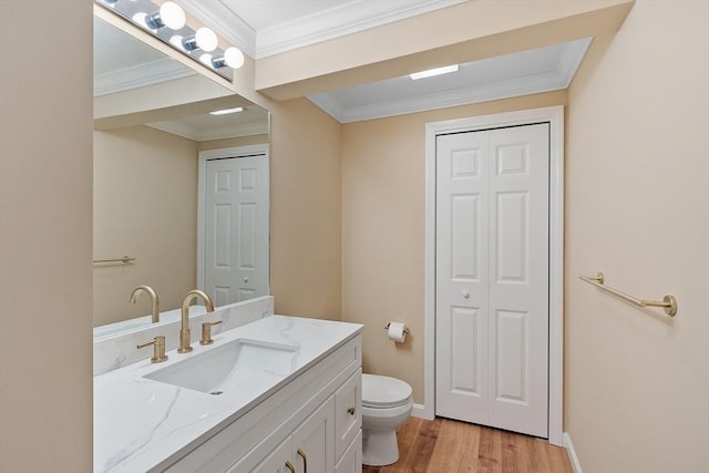 98 Caspian Way Unit 98, Fitchburg, MA 01420 - bathroom with toilet, baseboards, wood finished floors, a closet, and vanity