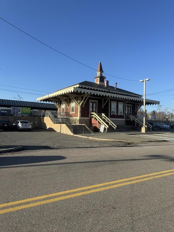 view of front of property featuring a tile roof