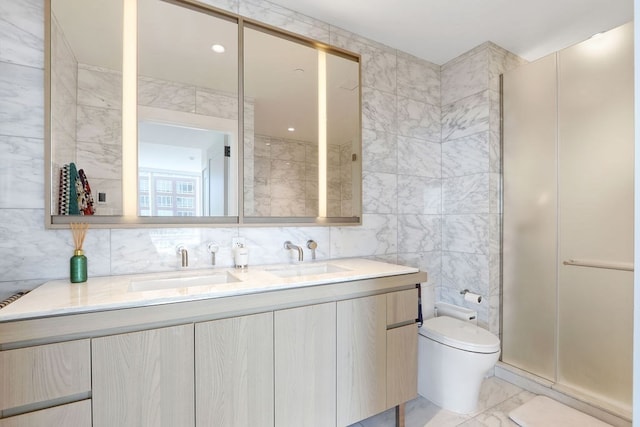 bathroom featuring tile walls, a shower with shower door, vanity, toilet, and a bidet