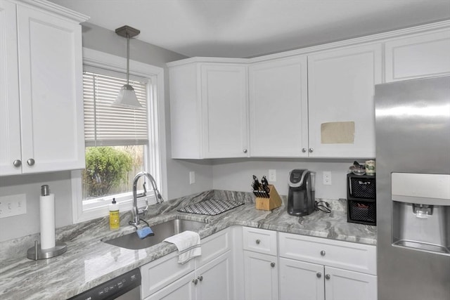 340 Dale St Unit A, Chicopee, MA 01020 - kitchen featuring hanging light fixtures, a sink, stainless steel appliances, white cabinets, and light stone countertops