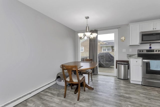 340 Dale St Unit A, Chicopee, MA 01020 - dining room with light wood-style floors, a chandelier, and a baseboard radiator