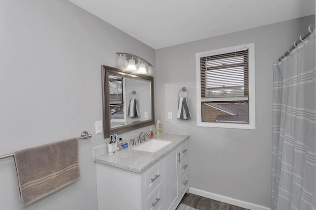 340 Dale St Unit A, Chicopee, MA 01020 - full bathroom featuring baseboards, vanity, a shower with shower curtain, and wood finished floors