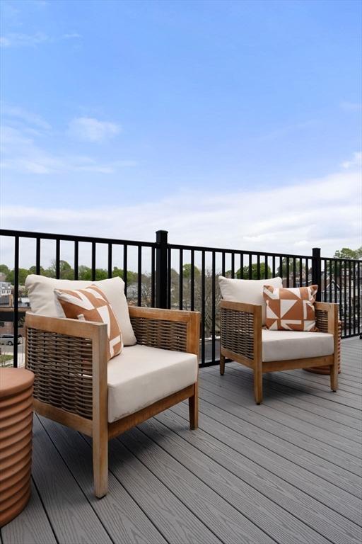 wooden terrace featuring outdoor lounge area