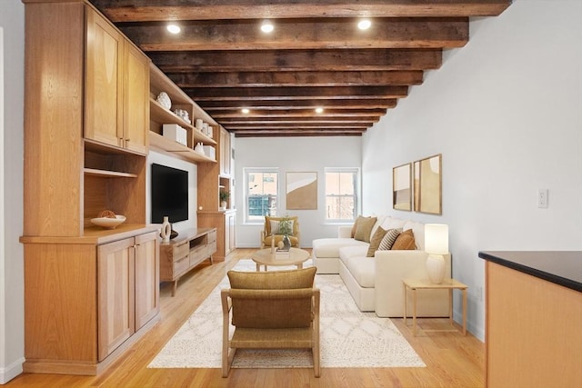 living room with beam ceiling and light wood-type flooring