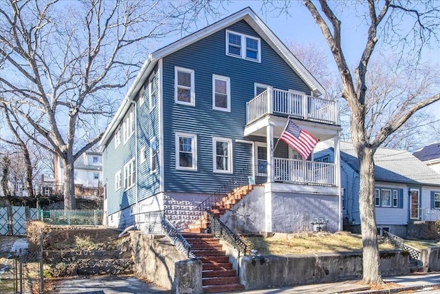 view of front of property with a balcony