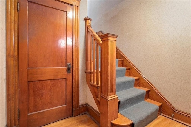 stairway with wood-type flooring