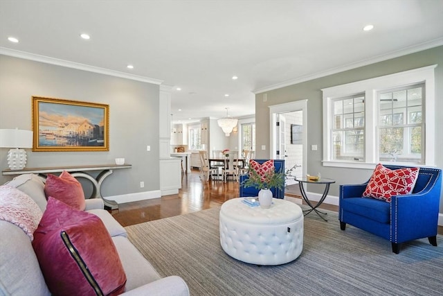 living room with crown molding, recessed lighting, and wood finished floors