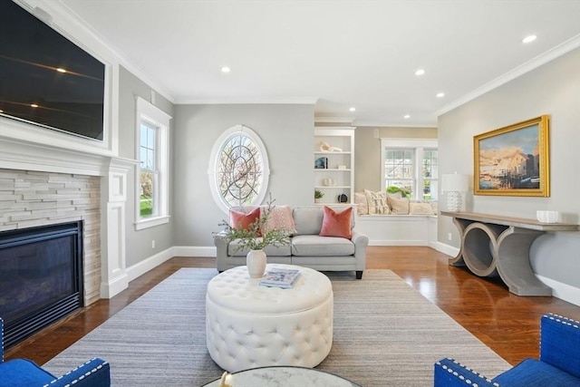 living area with a healthy amount of sunlight, recessed lighting, and wood finished floors
