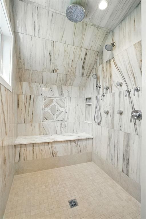 full bath with tiled shower