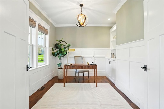 interior space with visible vents, crown molding, a wainscoted wall, dark wood-style floors, and a decorative wall