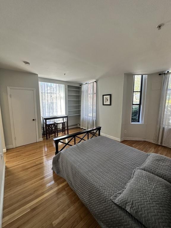 bedroom with hardwood / wood-style flooring