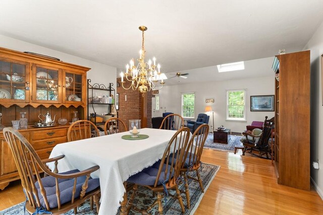 12 Robin Ln, Pepperell, MA 01463 - dining area featuring a chandelier and light wood finished floors