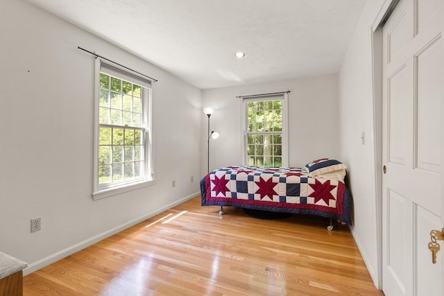 12 Robin Ln, Pepperell, MA 01463 - bedroom with multiple windows, baseboards, light wood-type flooring, and recessed lighting