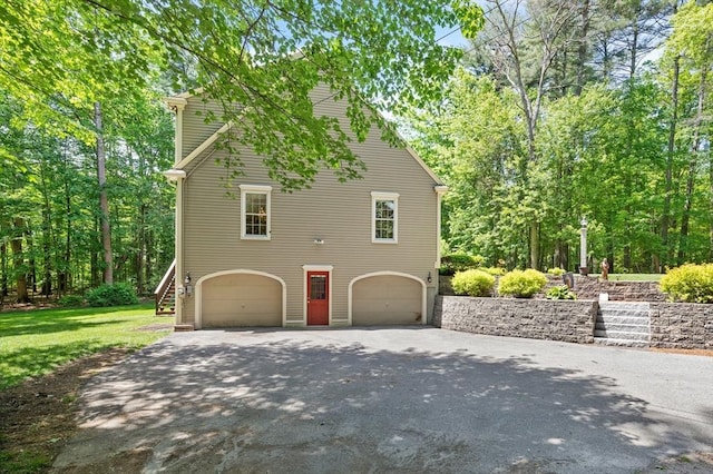 12 Robin Ln, Pepperell, MA 01463 - view of home's exterior with a garage, driveway, and stairway