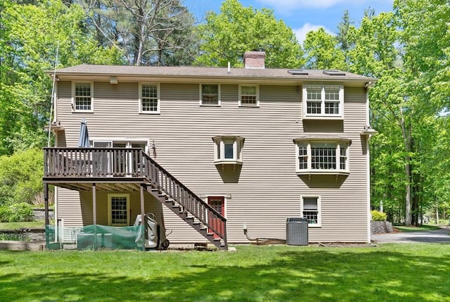 12 Robin Ln, Pepperell, MA 01463 - rear view of property with stairway, a wooden deck, a chimney, and a yard