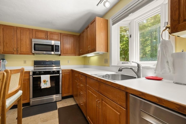 12 Robin Ln, Pepperell, MA 01463 - kitchen with stainless steel appliances, plenty of natural light, light countertops, and a sink