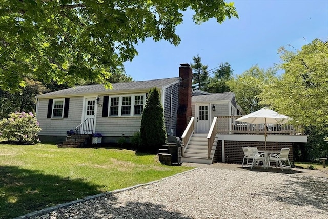 20 Judys Ln, Chatham, MA 02633 - back of house featuring a yard, a chimney, a wooden deck, a patio area, and entry steps