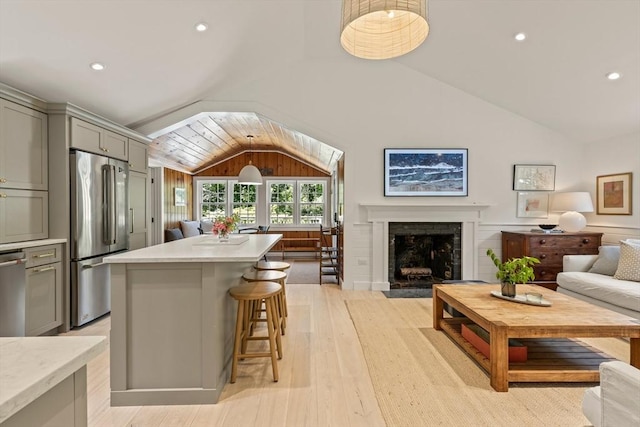 20 Judys Ln, Chatham, MA 02633 - kitchen featuring stainless steel refrigerator, gray cabinets, lofted ceiling, open floor plan, and light countertops