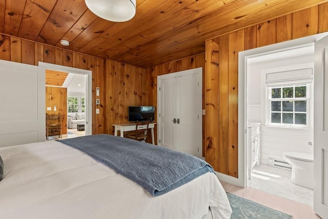 20 Judys Ln, Chatham, MA 02633 - bedroom featuring baseboard heating, multiple windows, wooden ceiling, wood walls, and ensuite bathroom