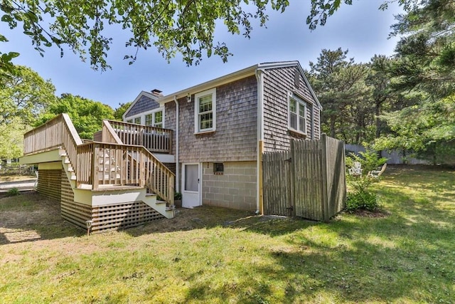 20 Judys Ln, Chatham, MA 02633 - rear view of property featuring stairs, a wooden deck, and a chimney