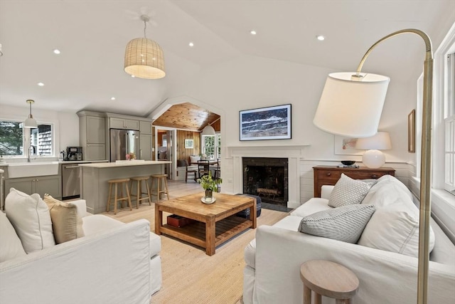 20 Judys Ln, Chatham, MA 02633 - living area with recessed lighting, light wood-type flooring, high vaulted ceiling, and a fireplace with flush hearth