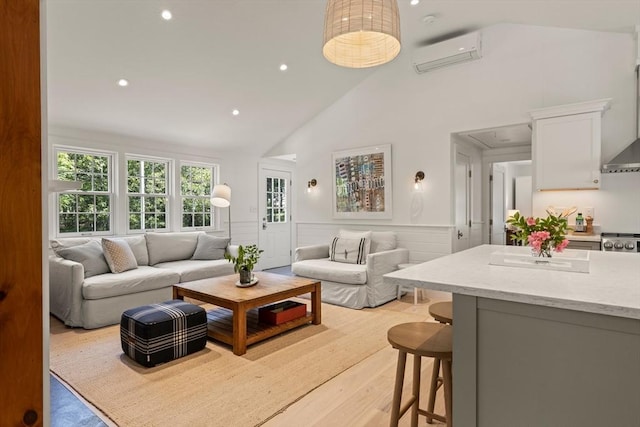 20 Judys Ln, Chatham, MA 02633 - living area with a wall mounted AC, attic access, wainscoting, recessed lighting, and high vaulted ceiling