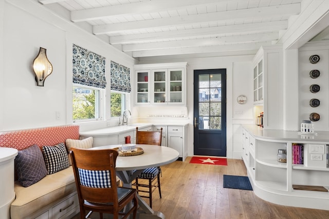 interior space with beamed ceiling and sink