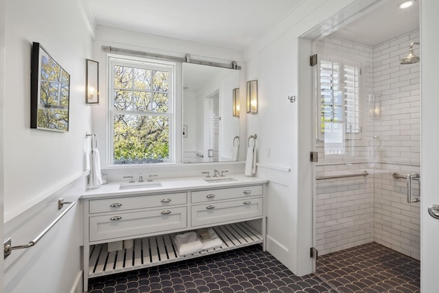 bathroom featuring tile floors, ornamental molding, a healthy amount of sunlight, and double sink vanity