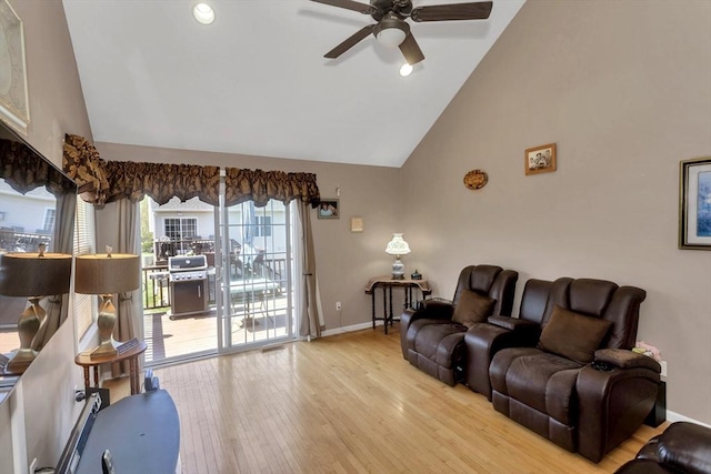 living room with high vaulted ceiling, wood finished floors, ceiling fan, baseboards, and recessed lighting