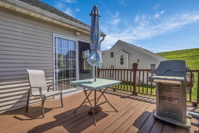 wooden terrace with area for grilling